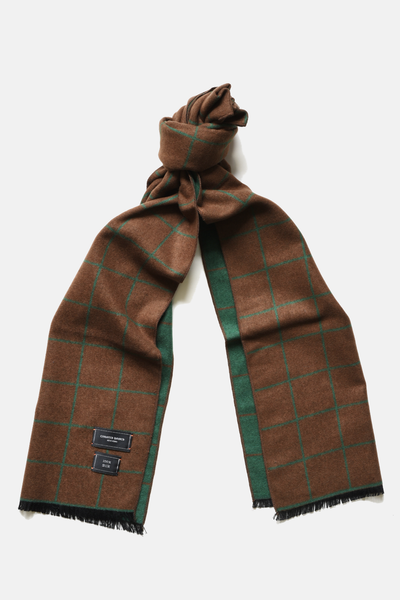 Brown and green plaid scarf on a white background